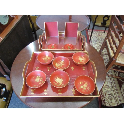 1129 - A set of three Regency style painted trays, book ends and dishes