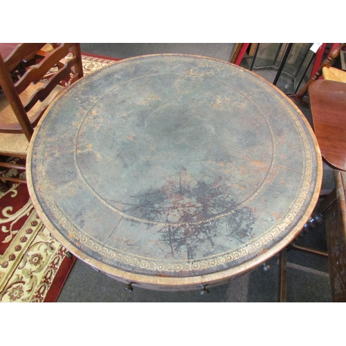 1136 - A Regency mahogany drum form table, the gilt tooled leather inset top over frieze drawers, on quatre... 