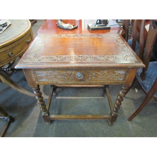 1139 - A 19th Century carved oak single drawer side table, with barley twist supports on stretcher base, 72... 