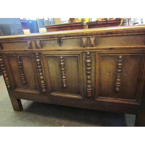 1148 - An 18th Century country oak coffer, three panel front with applied spindle detail, stile legs, 67cm ... 