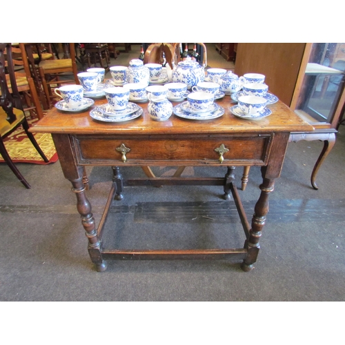 1162 - An 18th Century country oak side table, plank top, single frieze drawer, on turned supports joined b... 