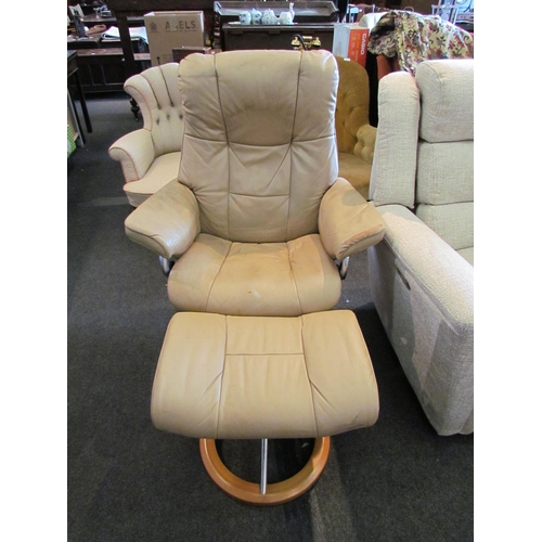 1183 - A 'Stressless' leather swivel chair with matching footstool, a/f wear present