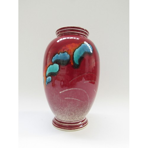 9082 - A Poole pottery volcano vase, marks to base.  21cm high