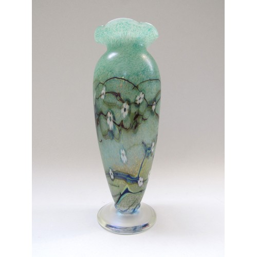 9138 - An Okra Glass vase in green with white flowers, iridescent foot.  Signed by Richard Golding to base.... 