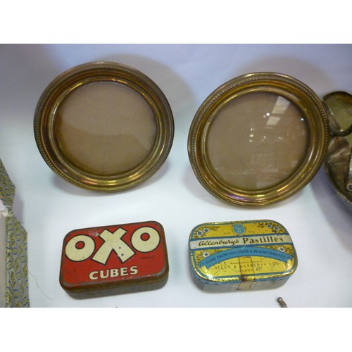 4438 - A mixed lot including plated ware, brass picture frames, vintage tins etc