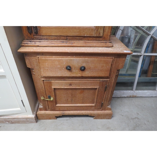 2278 - A pine cupboard, single drawers over single cupboard