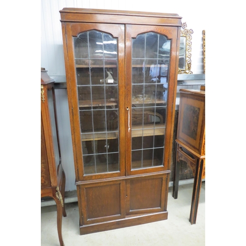 2157 - A 1930's oak and lead glazed bookcase