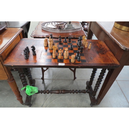 2173 - A Victorian inlaid chess games table, bobbin turned legs and turned cross stretcher with chess piece... 