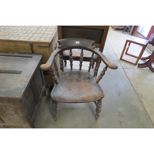 2184 - A Victorian elm seated captains chair