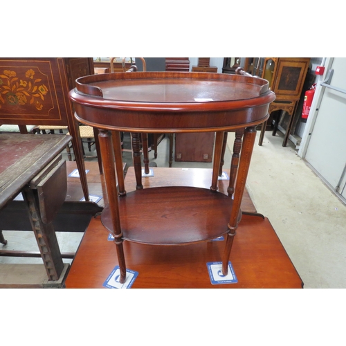 2200 - A mahogany oval two tier table