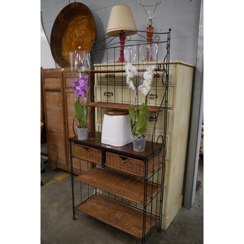 2296 - A metal and wicker unit two shelves to top, wooden top two baskets over two shelves