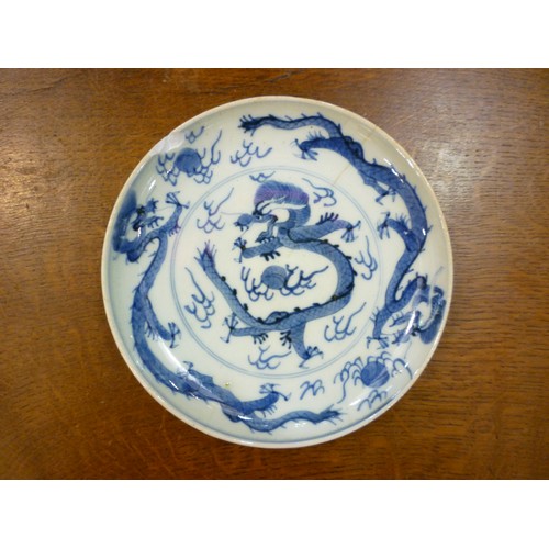 4476 - A Japanese blue and white dish and three further late 19th Century Chinese plates one decorated with... 