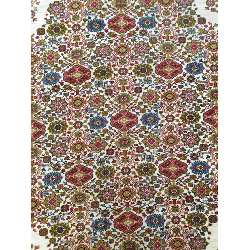 2376 - An Axminster carpet cream ground multi coloured overall pattern, twin borders 3.2 metres long, 2.74c... 