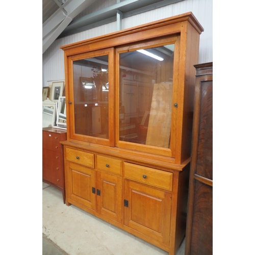 2344 - A large medium oak dresser, the glazed top over a three drawer and three door cupboard base