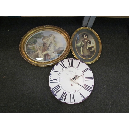 1197 - A gilt oval wall mirror, two prints and a battery operated wall clock together with three candle hol... 