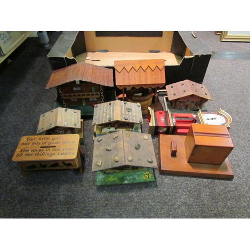 1210 - A box of various wooden musical Swiss chalets, money box, wall clock etc.     (E) £10-15