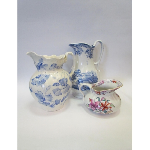 1229 - Three transfer ware jugs, two floral examples and a chinoiserie scene (3)