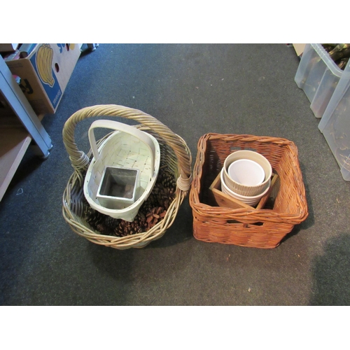 1264 - A vintage wicker basket, various planters and a quantity of pine cones