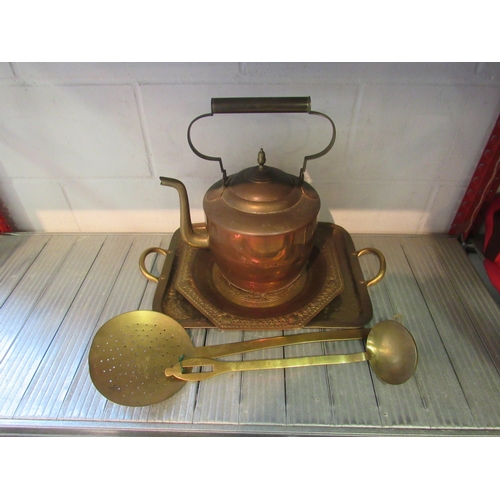 1265 - A large brass/copper kettle, trays and ladles