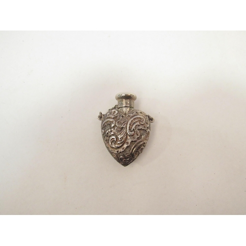 1332 - A silver embossed scent bottle in the form of a heart