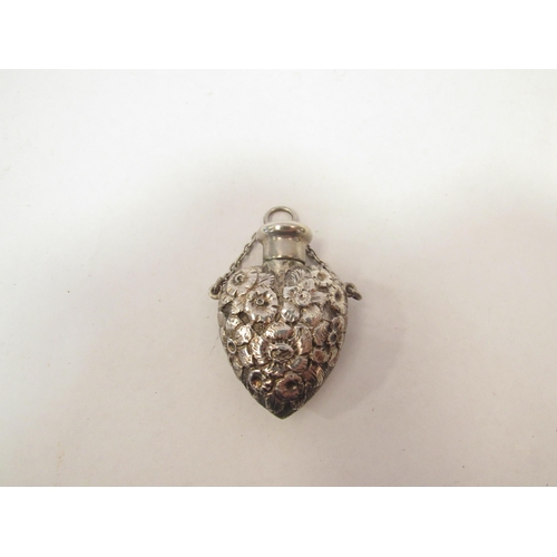 1332 - A silver embossed scent bottle in the form of a heart