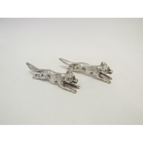 1333 - Two silver fox form knife rests