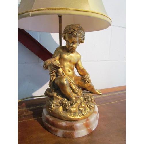 1007 - A gilded cherub table lamp