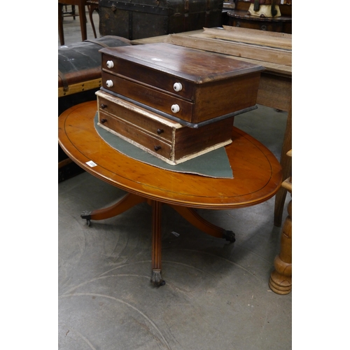 2228 - A yew wood coffee table, oval form outswept legs   (E) £5-10