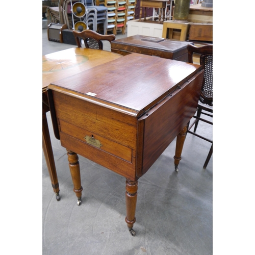 2231 - A 19th Century mahogany campaign table with unscrewable legs, the top lifts to reveal a washstand