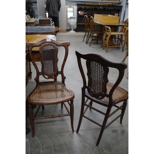 2234 - A pair of Victorian faux rosewood cane back and seat bedroom chairs, turned legs and cross stretcher