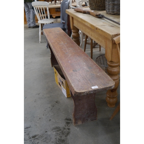 2253 - A rustic pine bench, shaped ends