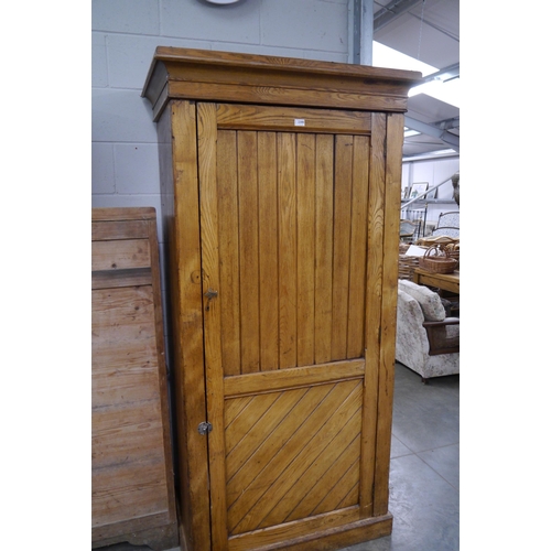 2300 - A Victorian ash single door wardrobe