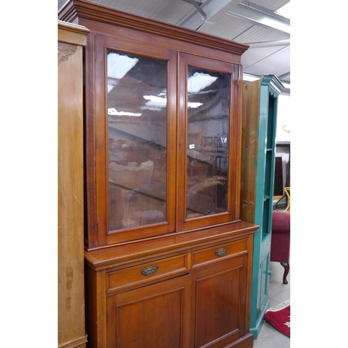 2313 - An Edwardian walnut glazed top cupboard bookcase