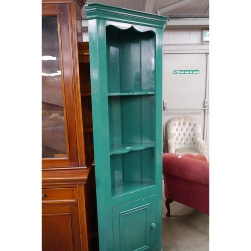 2314 - A green painted pine full height corner cupboard