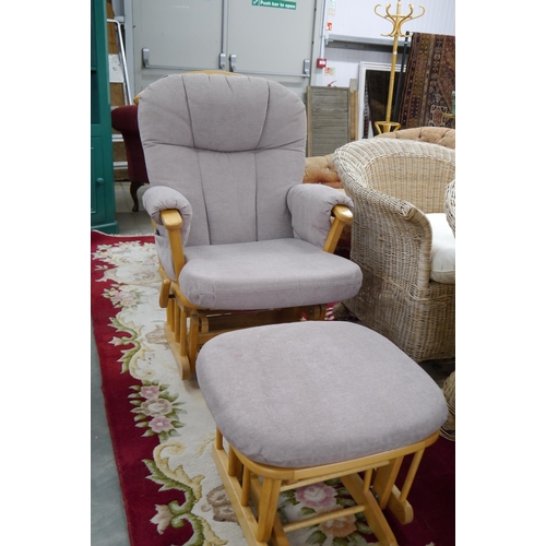 2316 - A pine nursing/rocking chair and stool, upholstered in taupe fabric