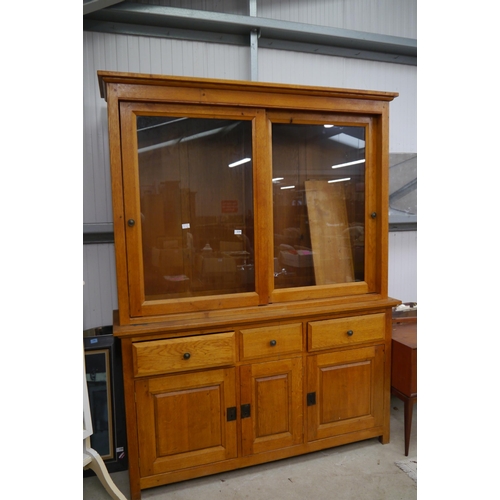 2344 - A large medium oak dresser, the glazed top over a three drawer and three door cupboard base