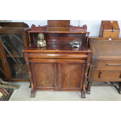 2118 - An early Victorian flame mahogany chiffonier, the scrolled foliate carved gallery back held by two s... 