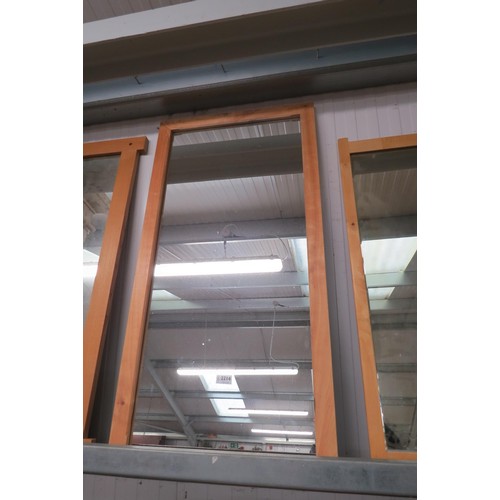 2214 - A beech framed wall mirror 54 x 106cm  (E) £15-20