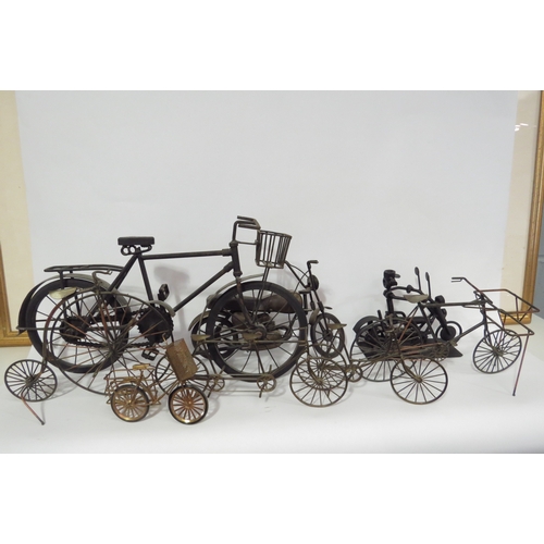 1303 - A quantity of metal models of bicycles including penny farthing