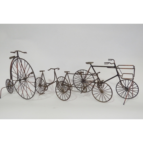 1303 - A quantity of metal models of bicycles including penny farthing