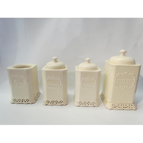 1391 - Four white ceramic storage jars (one lacking lid), a Franklin Mint spice rack and place mats etc.