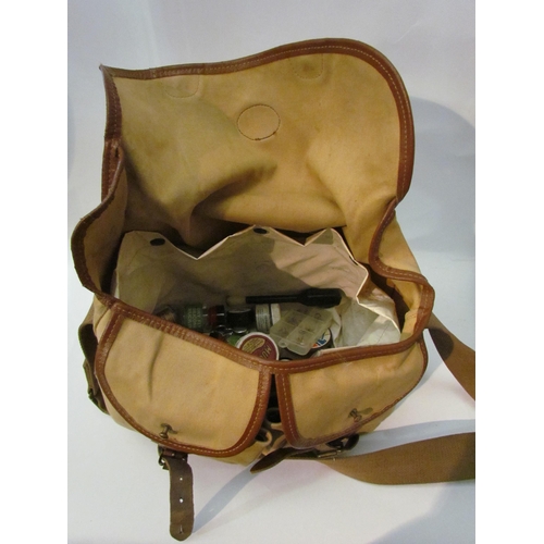 1419 - A Barbour canvas bag containing a quantity of fishing equipment including fishing fly cases with con... 