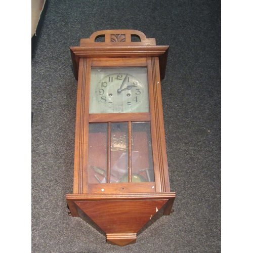 1466 - A 1940's oak wall clock, numerated chapter ring, key and pendulum     (E) £10-20