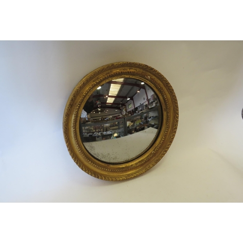 1495 - A 19th Century gilt convex wall mirror, 29cm diameter