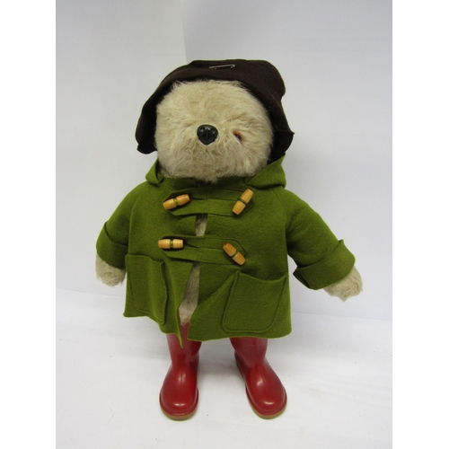 8287 - A vintage Gabrielle Designs Paddington Bear in original green duffle coat, brown hat and red welling... 