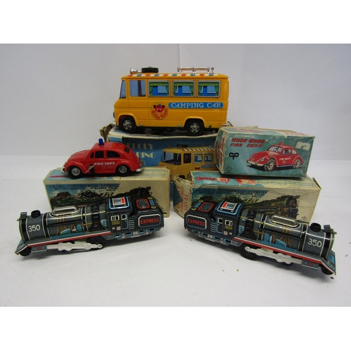 8338 - Four boxed vintage Japanese toy vehicles to include battery operated plastic Melody Camping Car, Kan... 