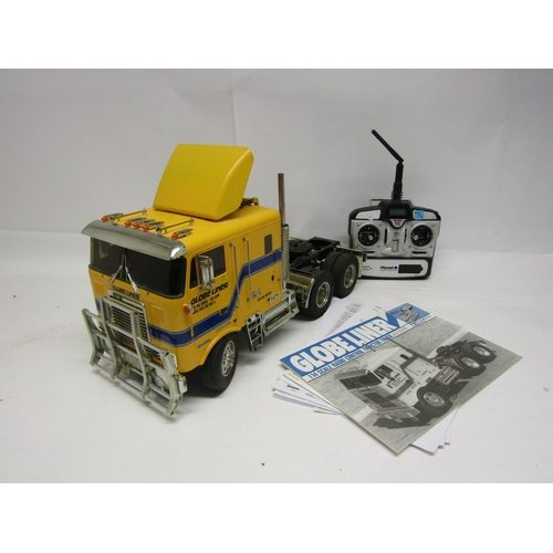 8410 - A Tamiya 1:14 scale kit built radio control Globe Liner Tractor Truck model No. 56304, with instruct... 