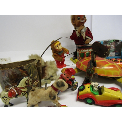 8343 - A collection of mostly playworn tinplate and mechanical novelty toys and vehicles including English ... 