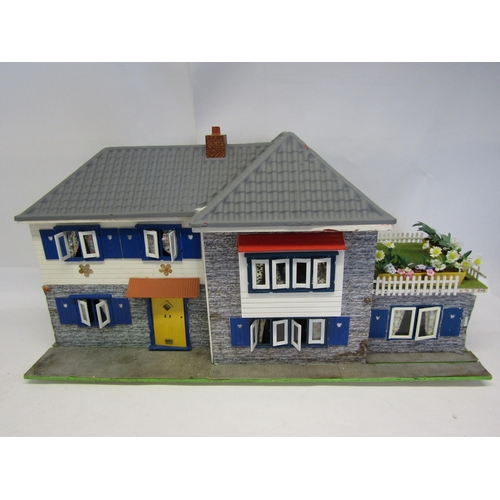 8268 - A wooden dolls house with sliding front, 43cm tall x 84cm wide     (E) £10-20