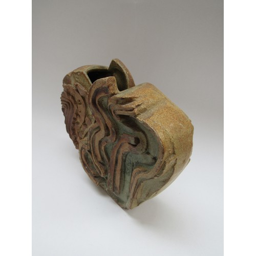 9096 - BERNARD ROOKE (b.1938): A studio pottery abstract form vase, 22cm high (chip to top)